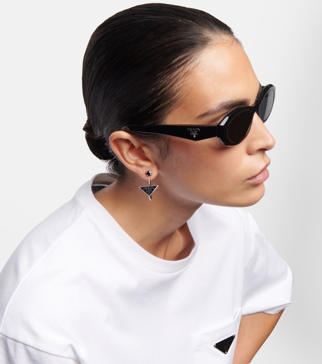 Symbole oval sunglasses in black Prada Mytheresa