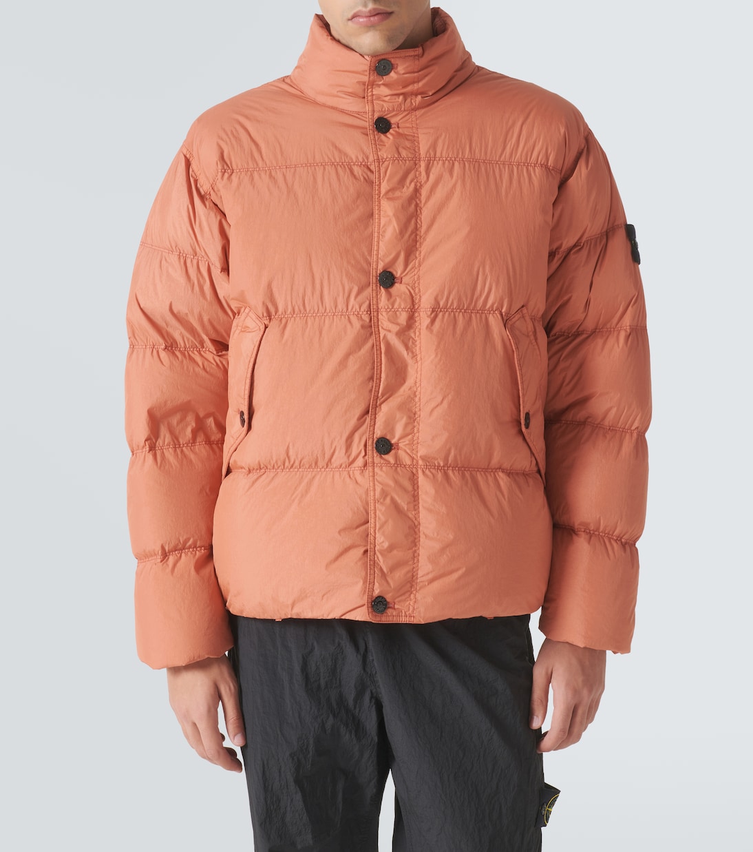 Compass down jacket in orange Stone Island Mytheresa