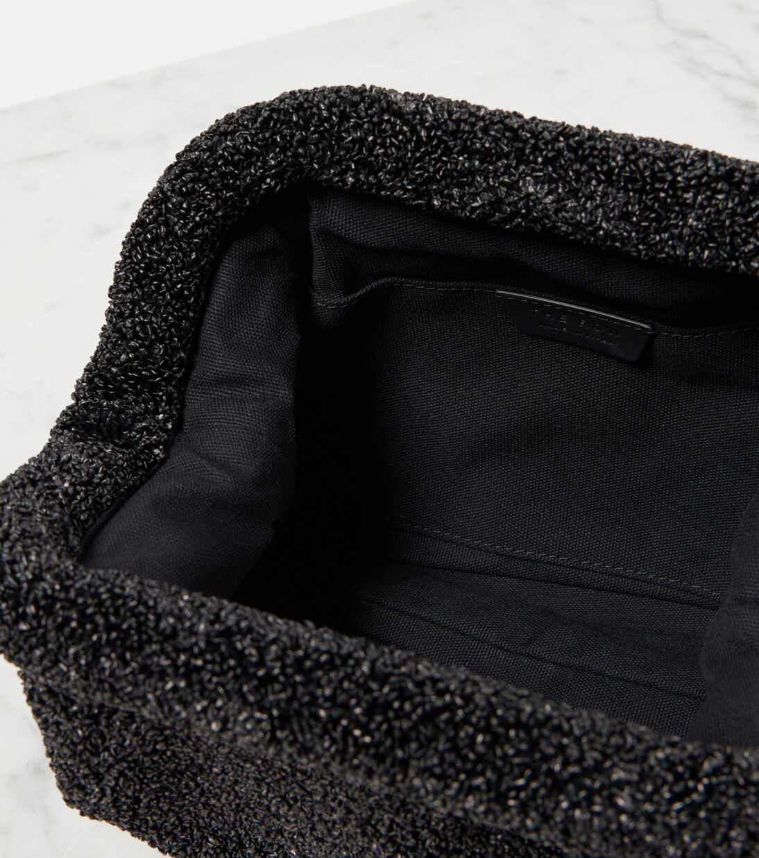 Mira raffia-effect clutch | The Row