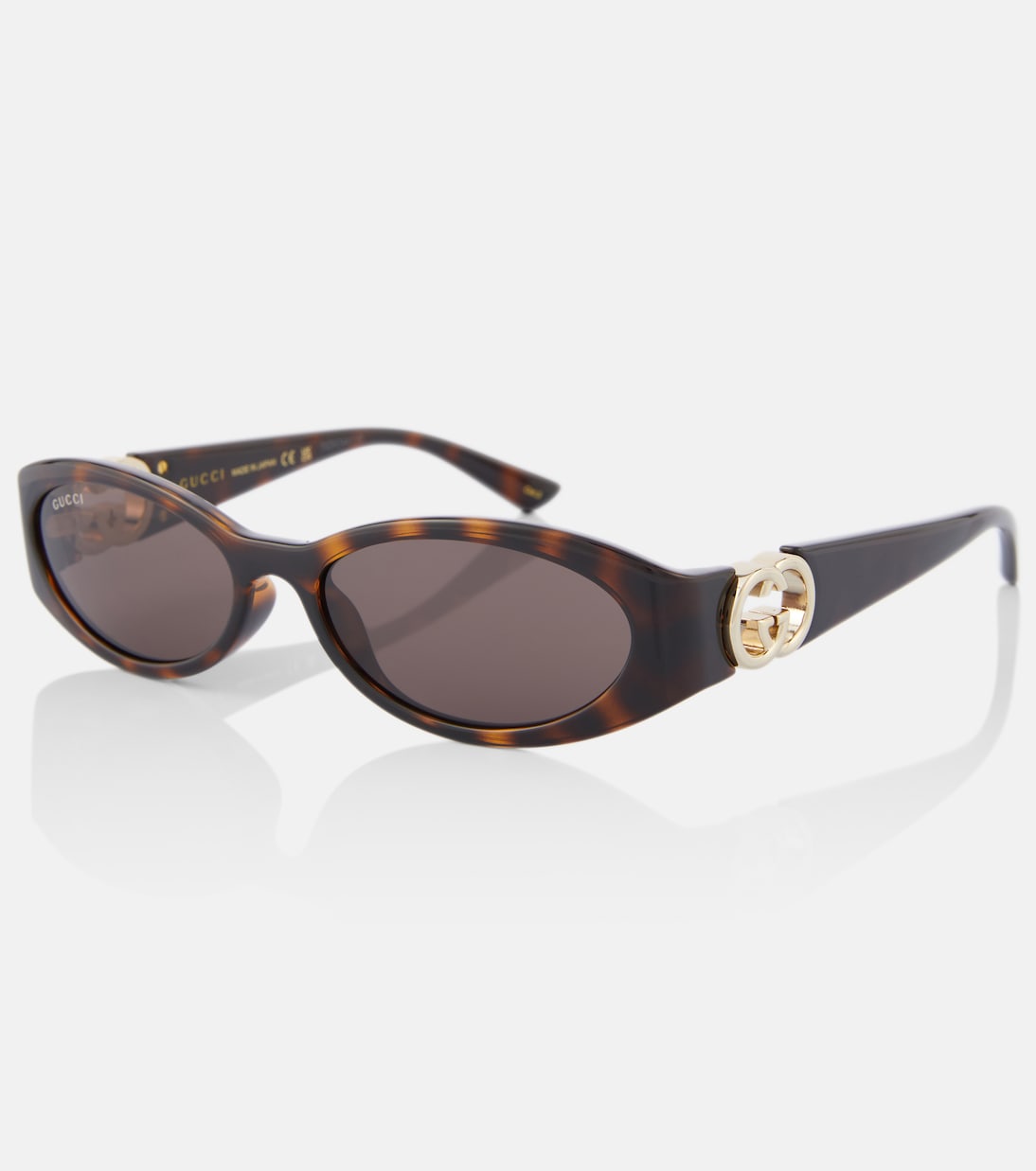 Occhiali da sole Interlocking G ovali | Gucci