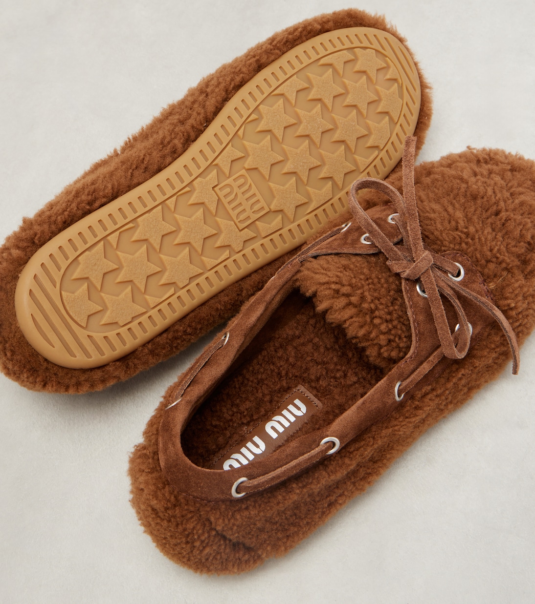 Suede-trimmed shearling boat shoes | Miu Miu