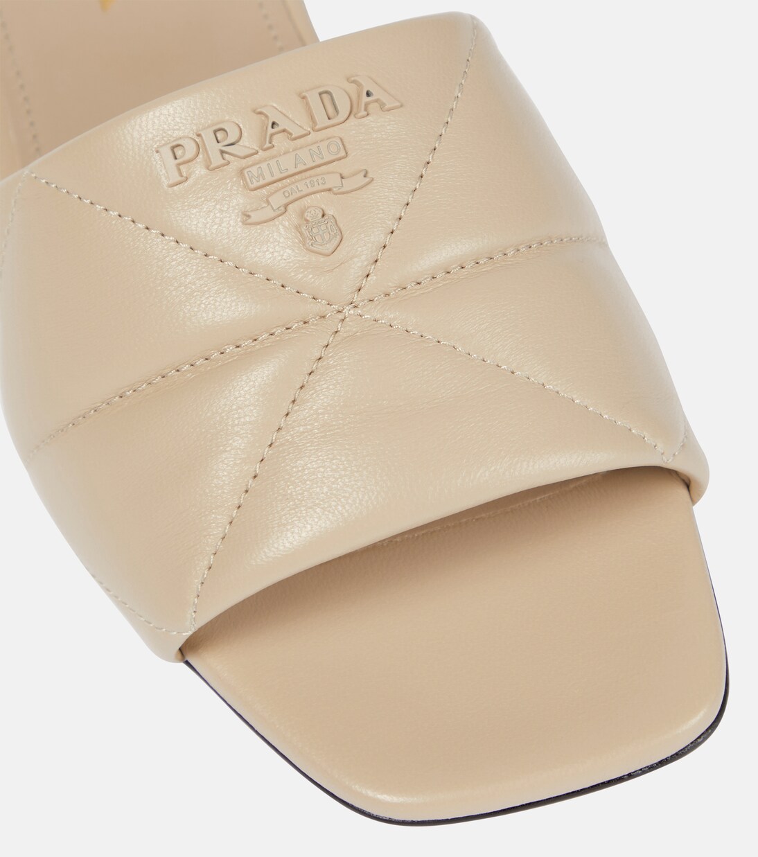 Quilted leather slides in beige - Prada | Mytheresa