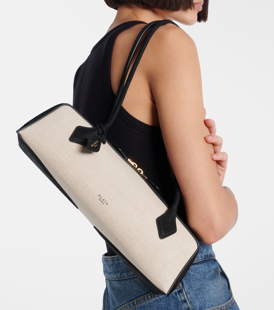 Le Teckel Small suede-trimmed shoulder bag | Alaïa
