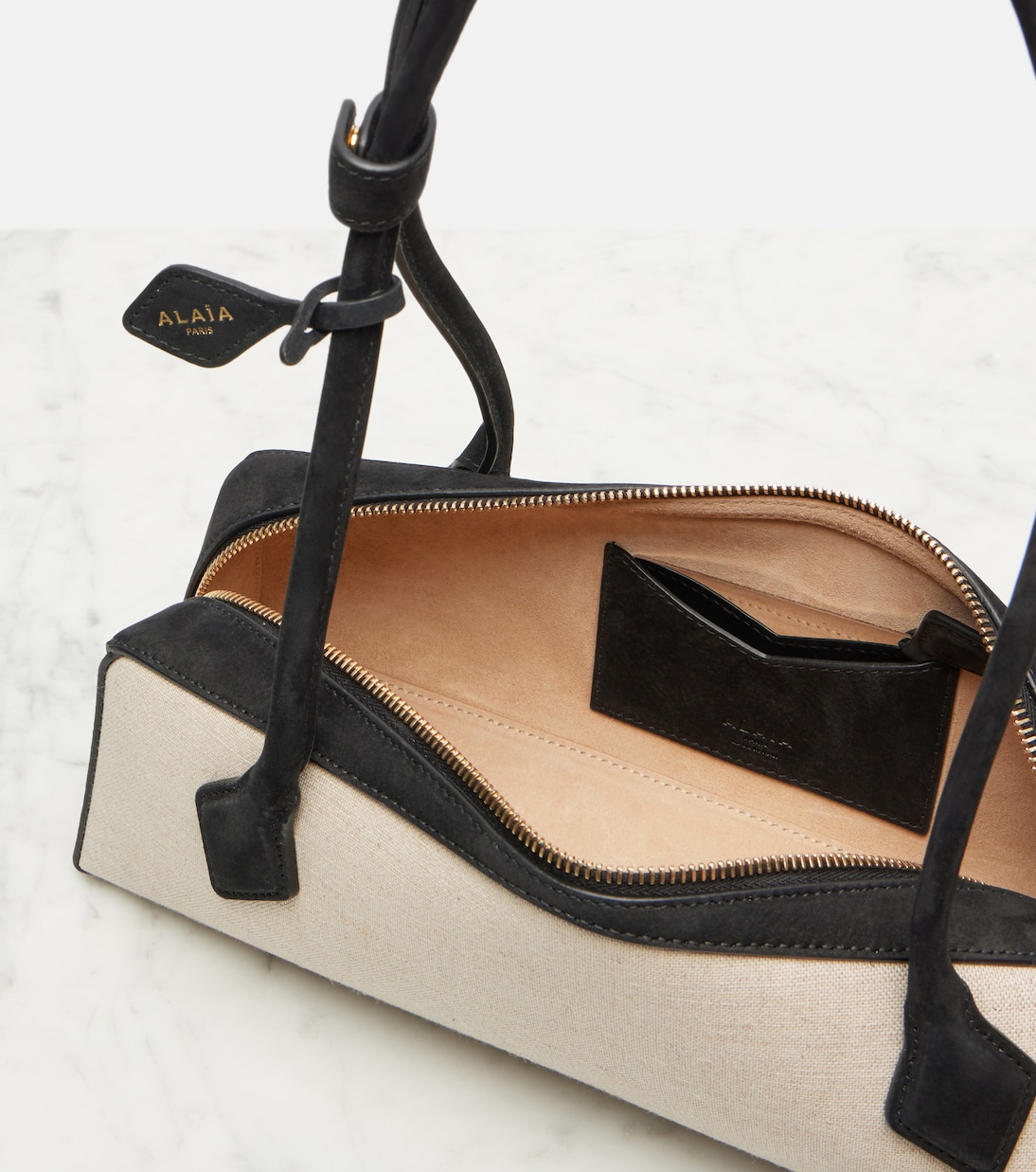 Le Teckel Small suede-trimmed shoulder bag | Alaïa