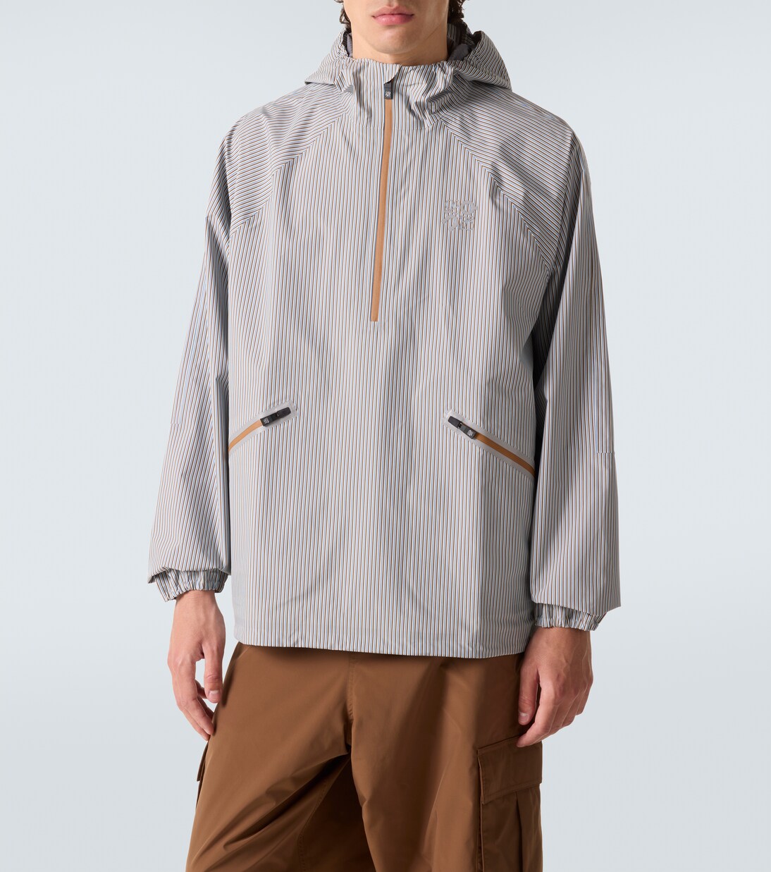 x On striped technical jacket  | Loewe