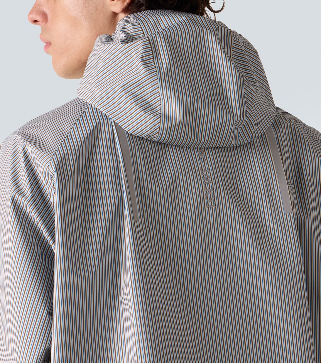 x On striped technical jacket  | Loewe