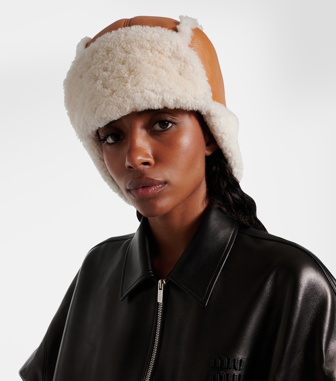 Shearling-trimmed leather hat | Miu Miu