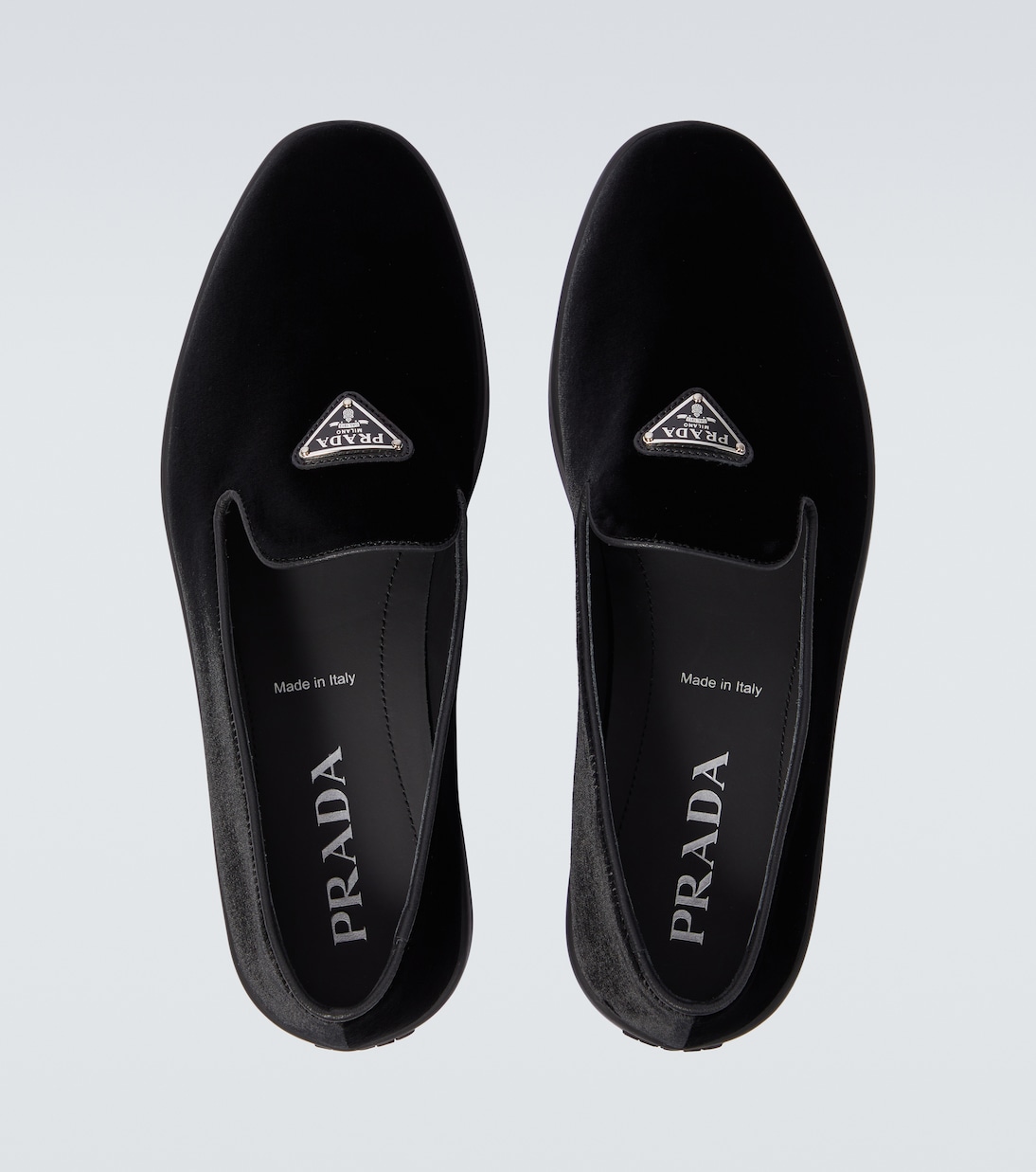Logo velvet loafers in black Prada Mytheresa