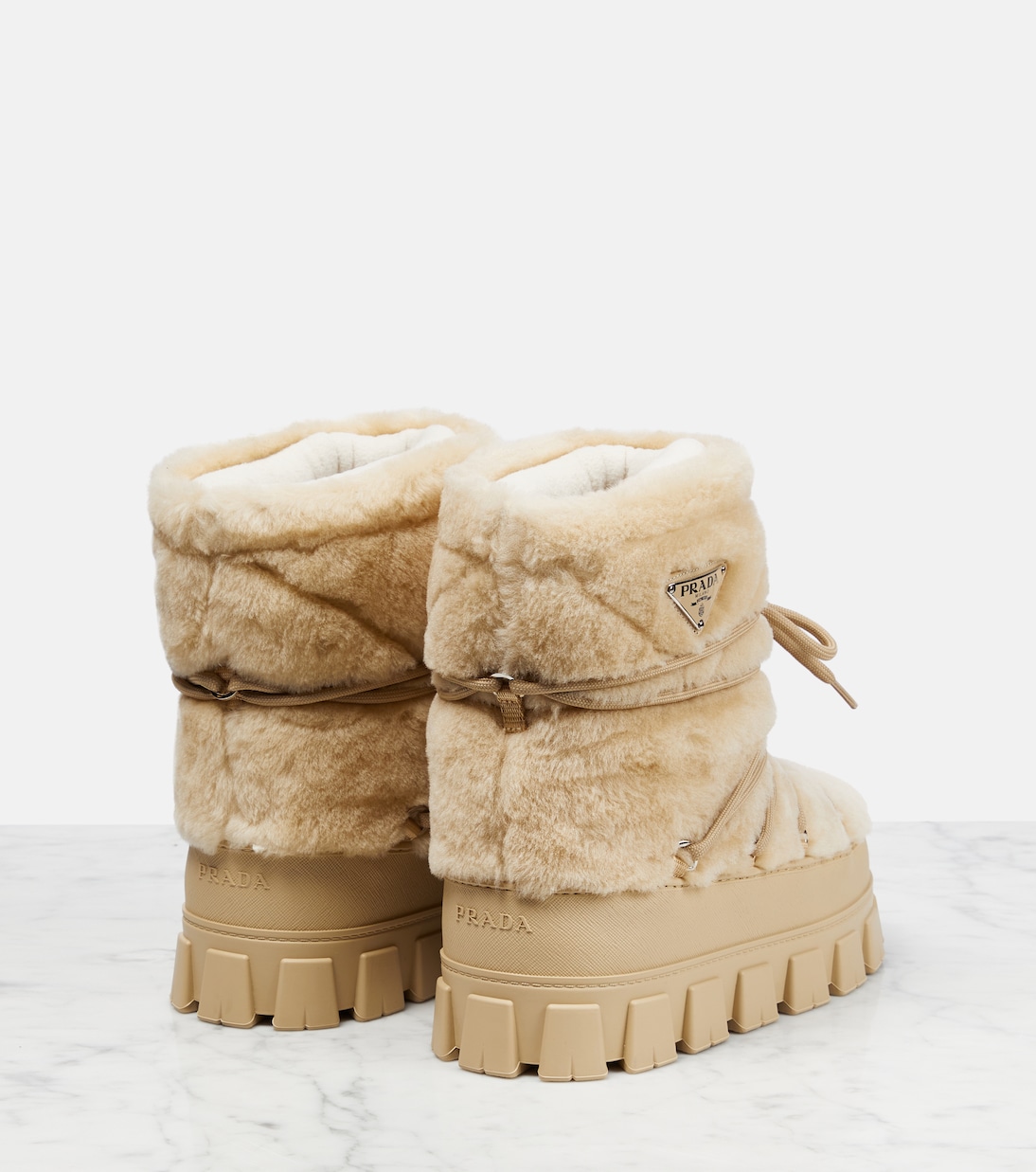 Shearling and leather snow boots | Prada
