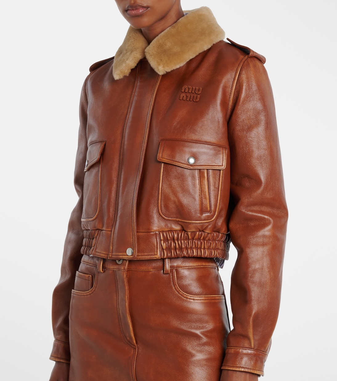 Shearling-trimmed leather jacket | Miu Miu
