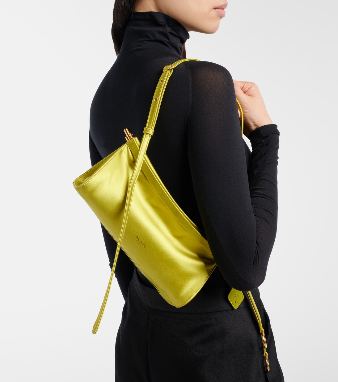 Le Click East West Small leather-trimmed satin shoulder bag | Alaïa