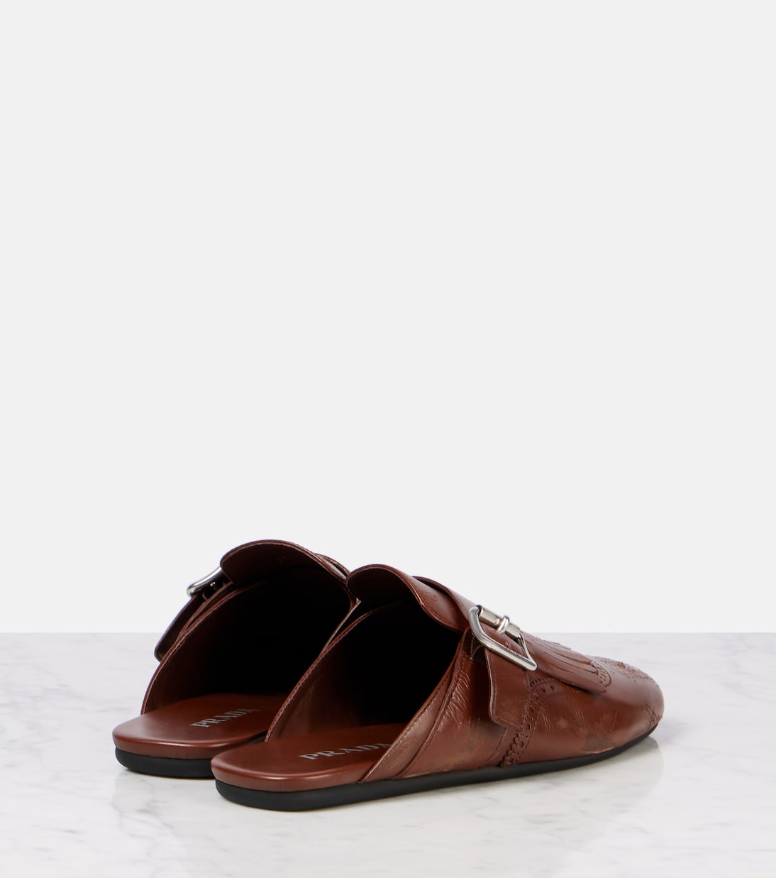 Mules Shuffle in pelle con frange | Prada