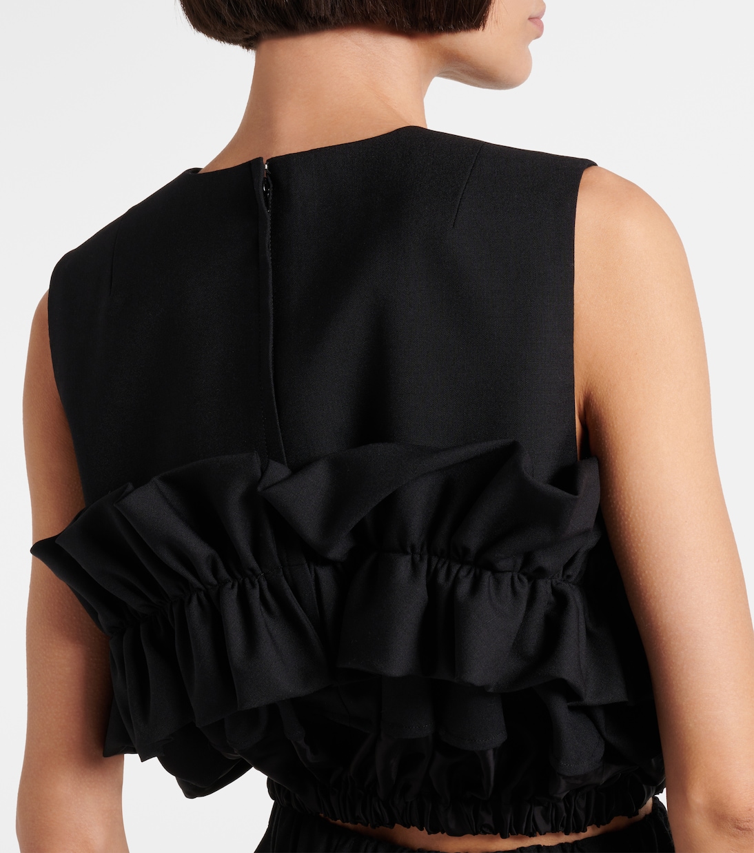 Ruffled wool top | Noir Kei Ninomiya