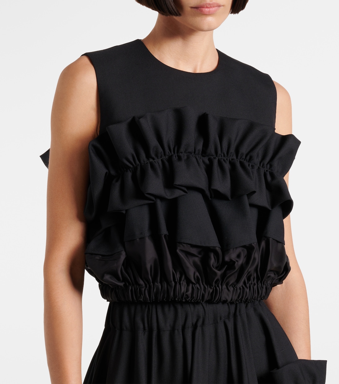 Ruffled wool top | Noir Kei Ninomiya