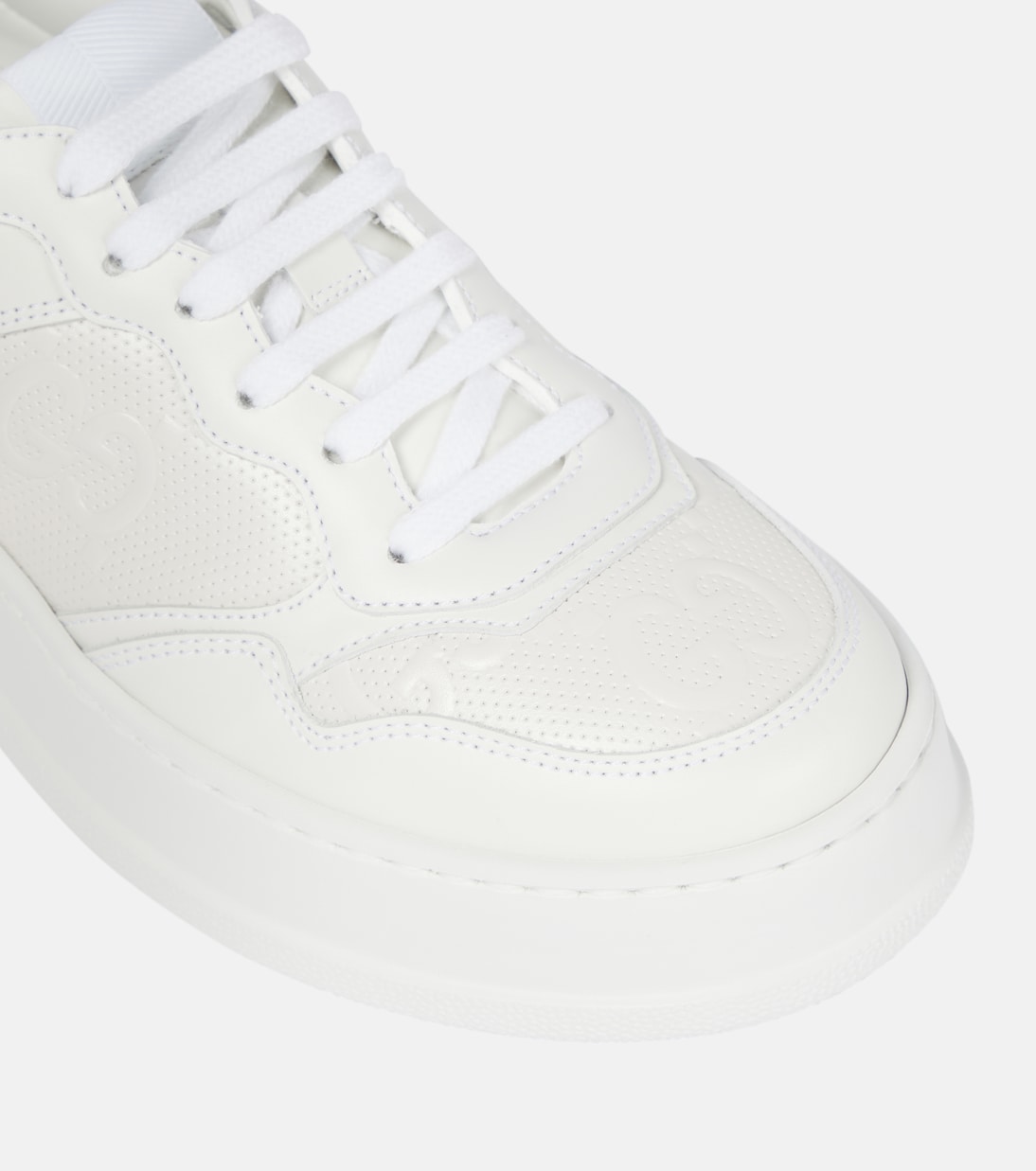 Baskets GG en cuir embossé | Gucci