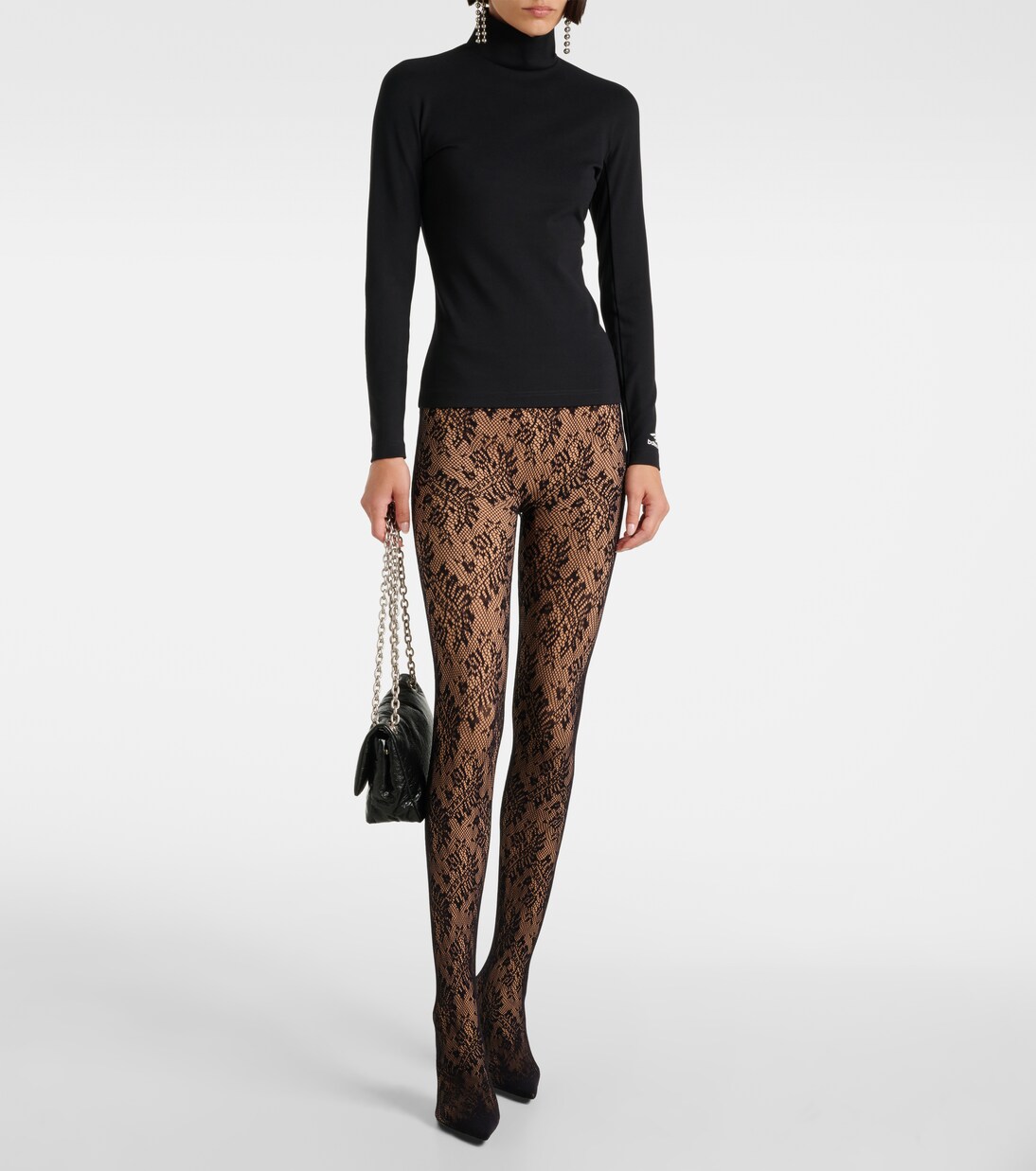 BALENCIAGA Leggings a mezza vita con dettagli in pizzo, perfette per uno stile giovane e moderno.