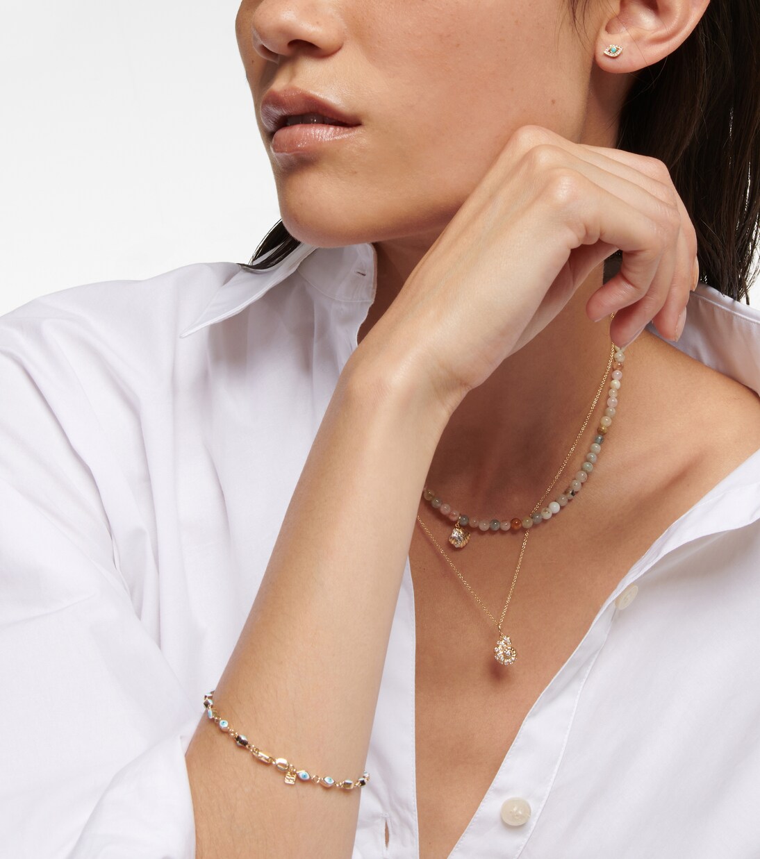 Collana in oro giallo 14kt con dettagli in diamanti e morganite, design elegante a conchiglia, perfetta per un look giovane e raffinato.