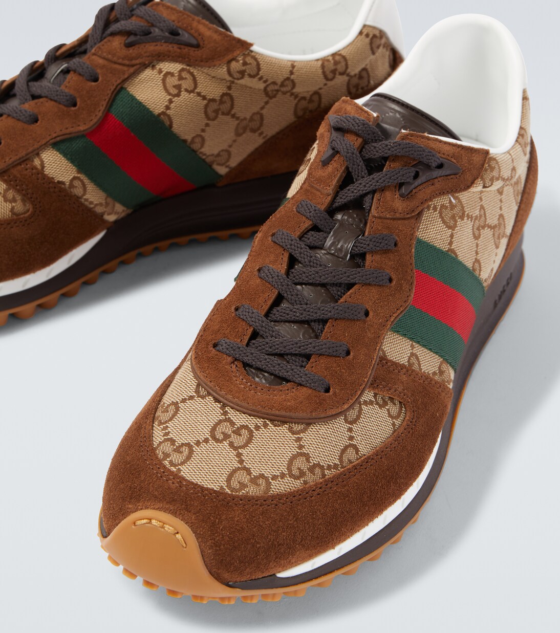 حذاء سنيكرز مقلّم بالجلد السويدي Re-Motion GG Canvas | Gucci