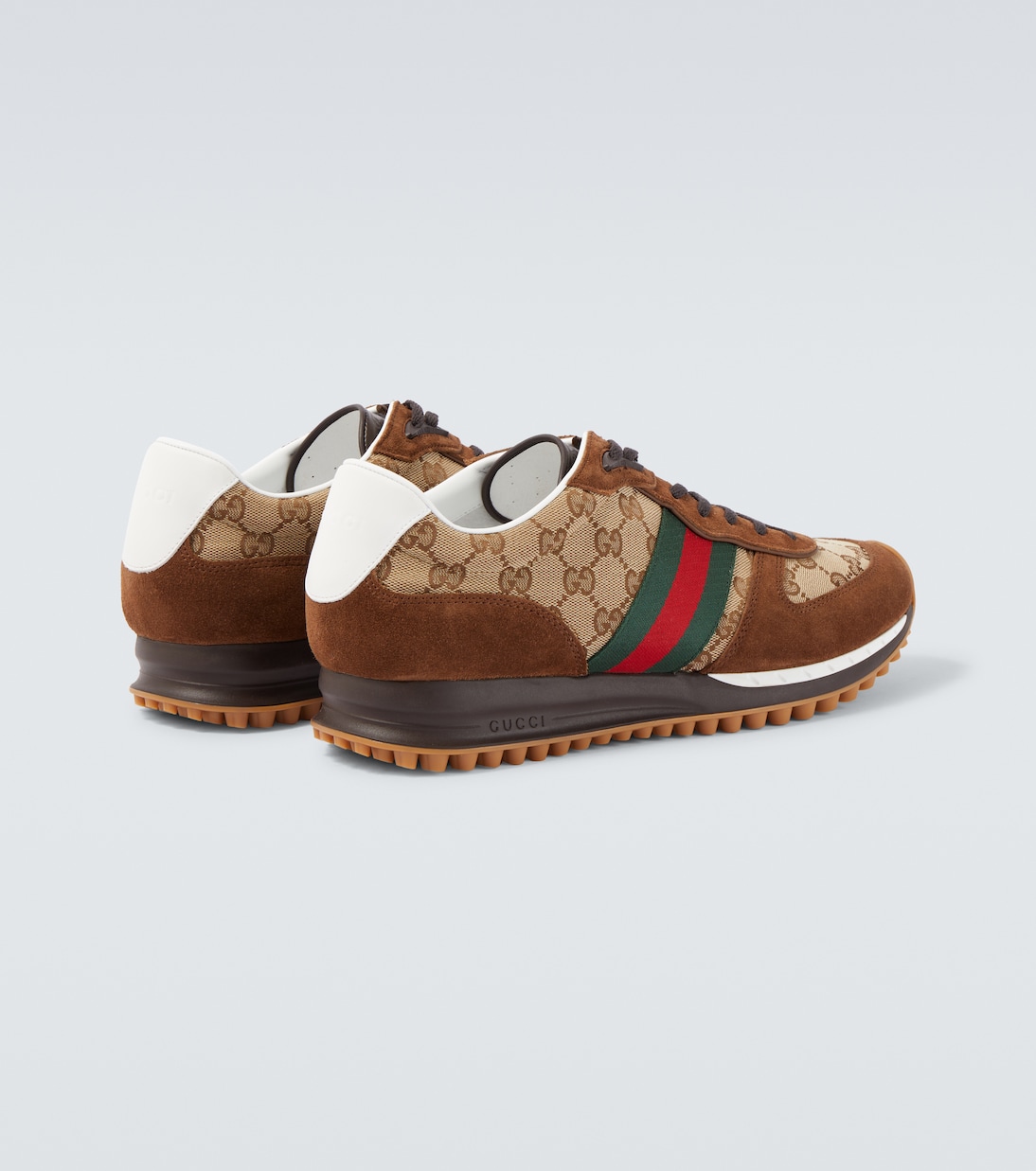 حذاء سنيكرز مقلّم بالجلد السويدي Re-Motion GG Canvas | Gucci