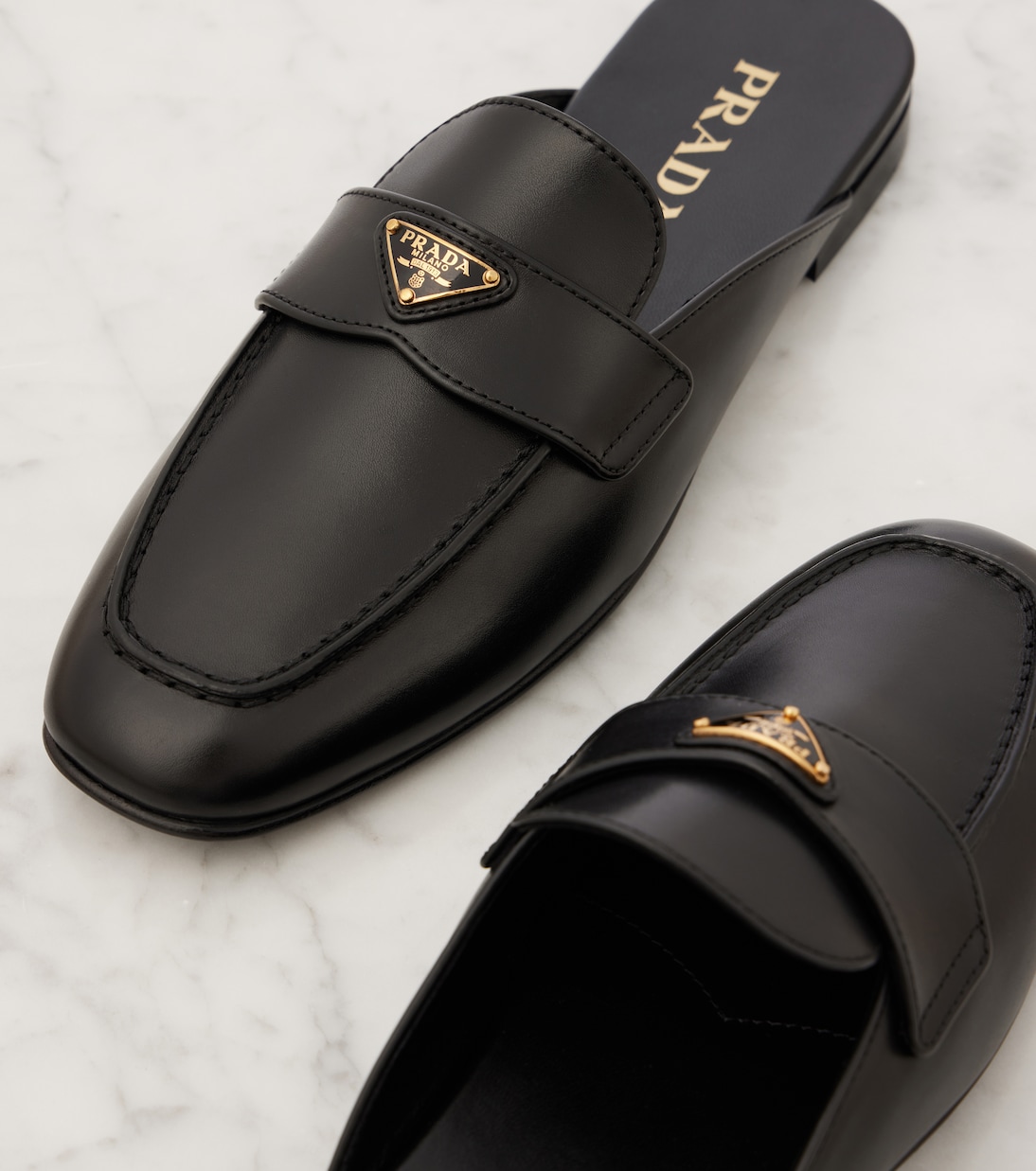 Mules in pelle | Prada
