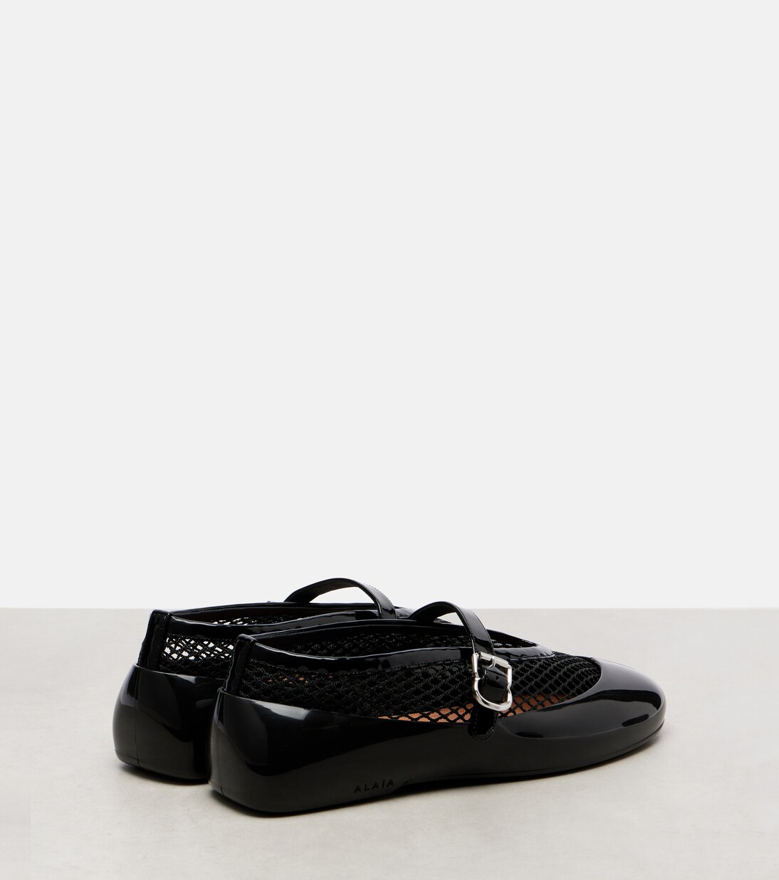 Leather-trimmed fishnet ballet flats | Alaïa