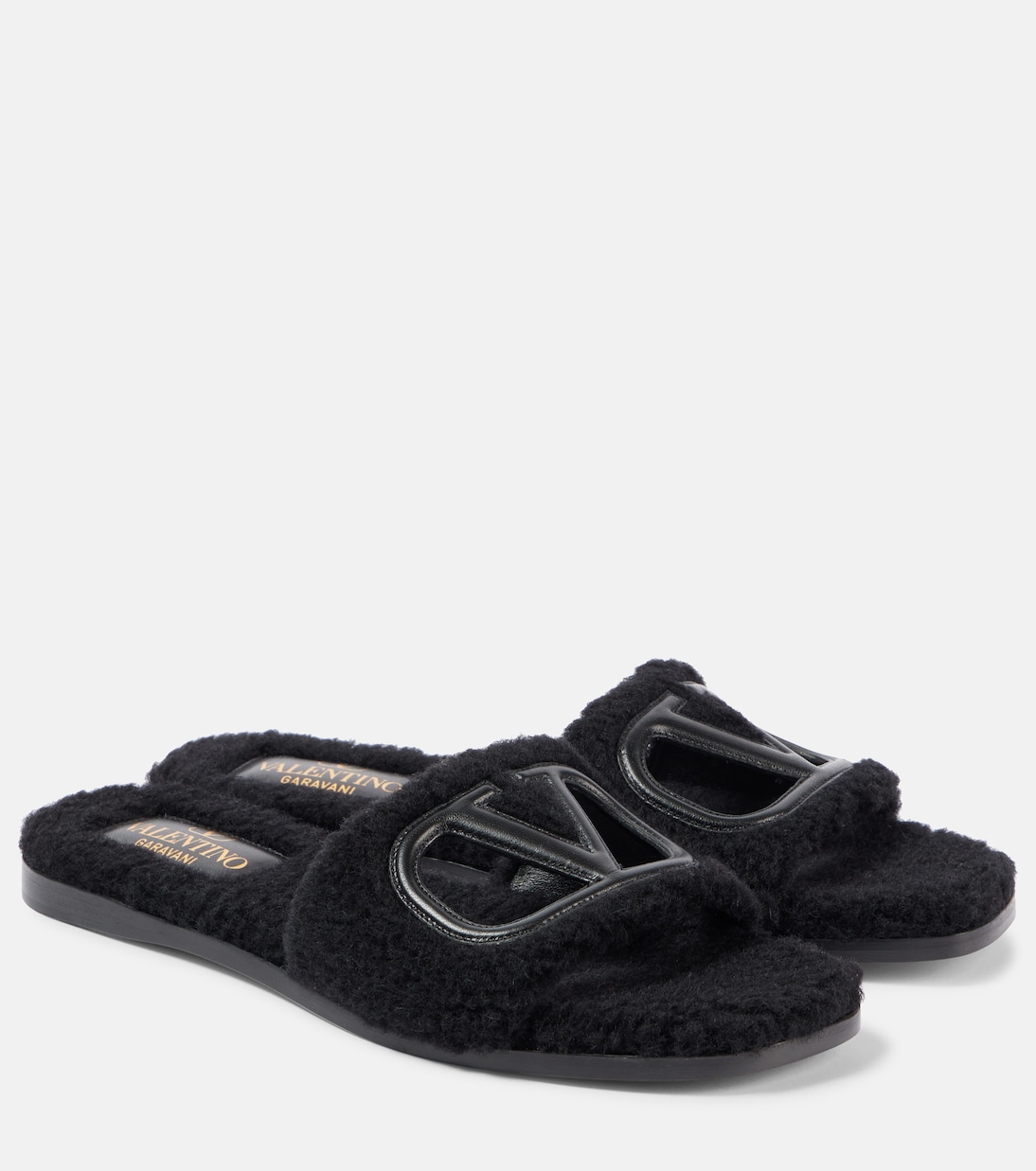 VLogo cutout faux shearling slides | Valentino Garavani