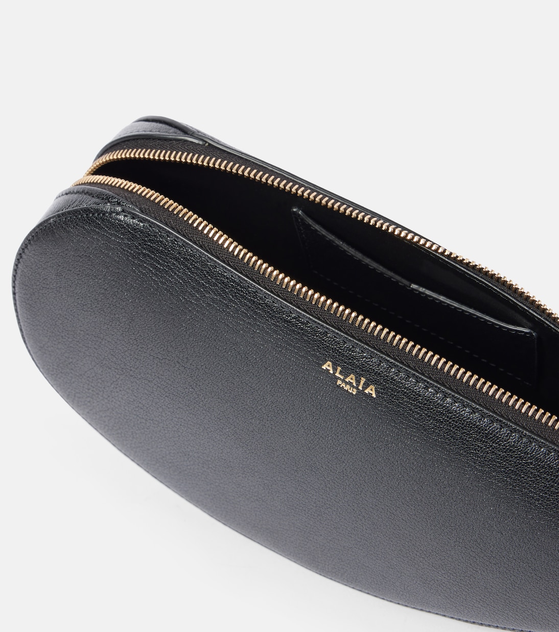 Clutch Le Demi Cœur aus Leder | Alaïa
