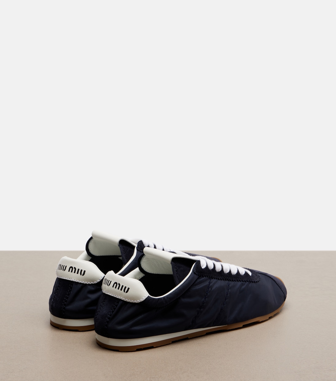 Plume suede-trimmed sneakers | Miu Miu