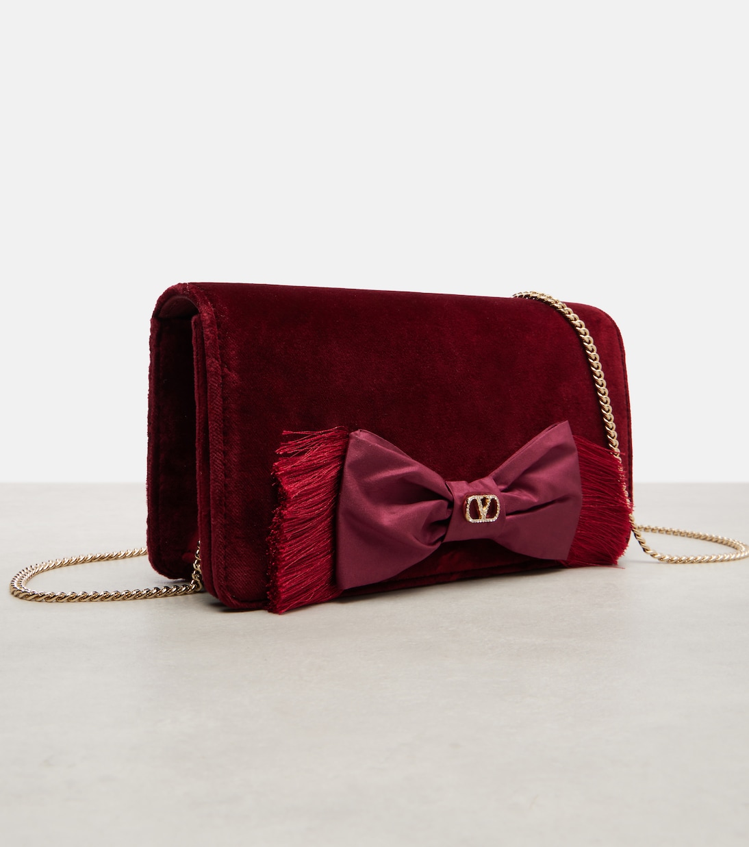 VLogo Mini bow-detail velvet crossbody bag | Valentino Garavani