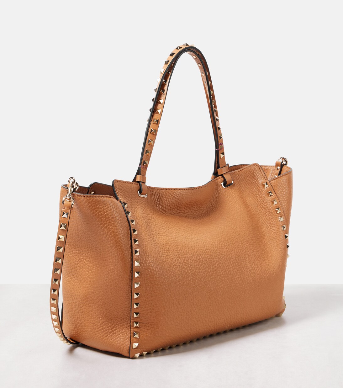 Rockstud Medium leather tote bag in beige Valentino Garavani Mytheresa