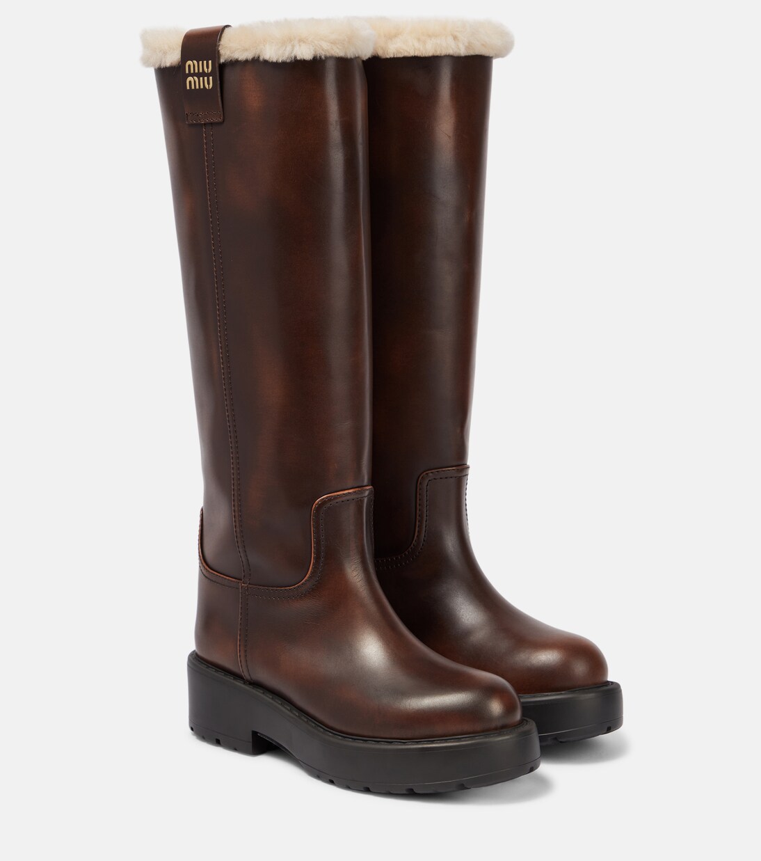 Shearling lined leather knee high boots in brown Miu Miu Mytheresa