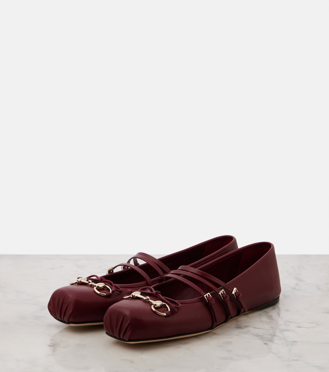 Horsebit leather ballet flats in burgundy Gucci Mytheresa