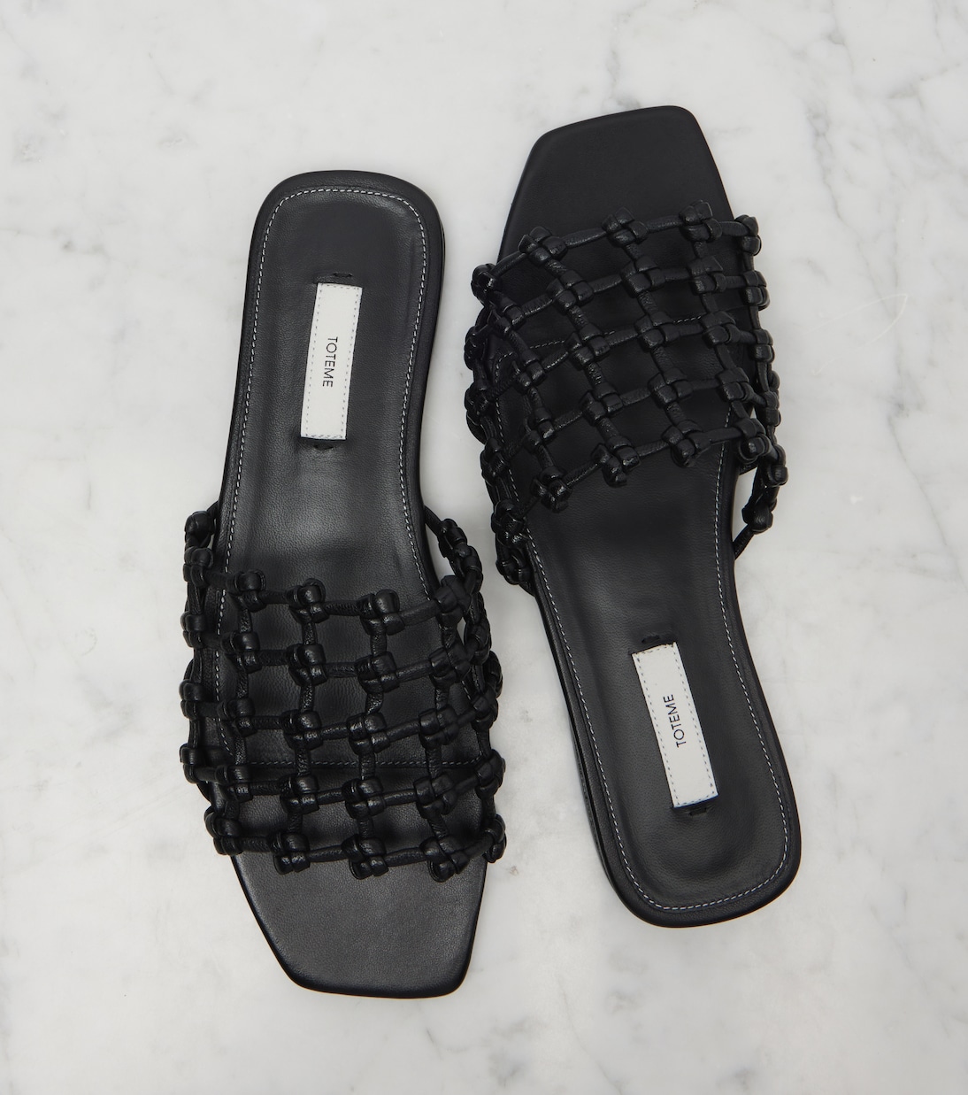 Woven leather slides | Toteme
