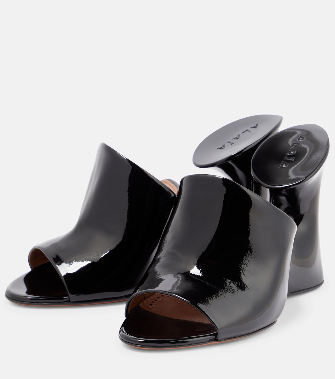 Mules Sculpture en cuir verni | Alaïa