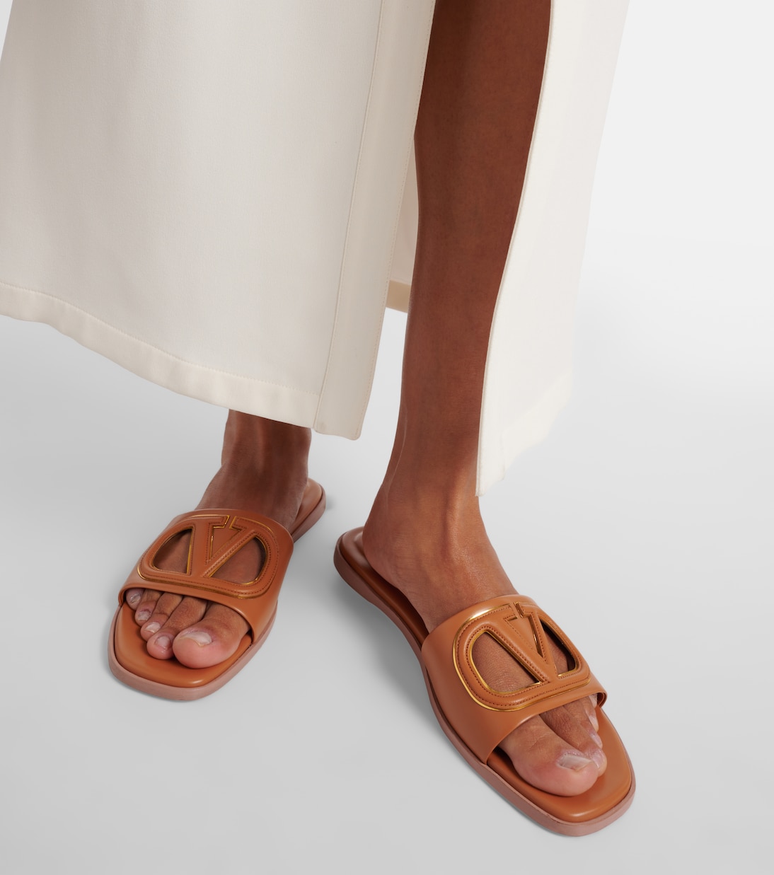 VLogo cutout leather slides | Valentino Garavani