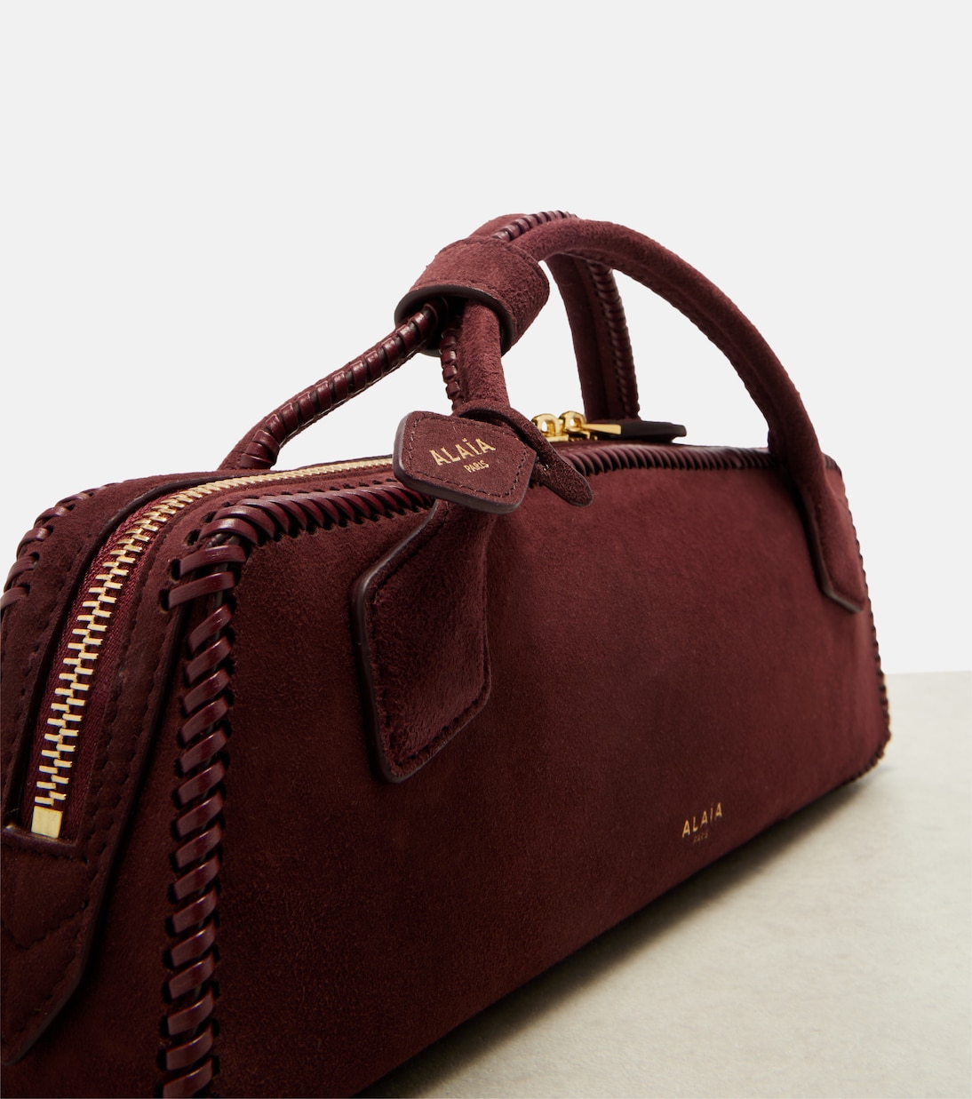 Le Teckel Small suede clutch | Alaïa