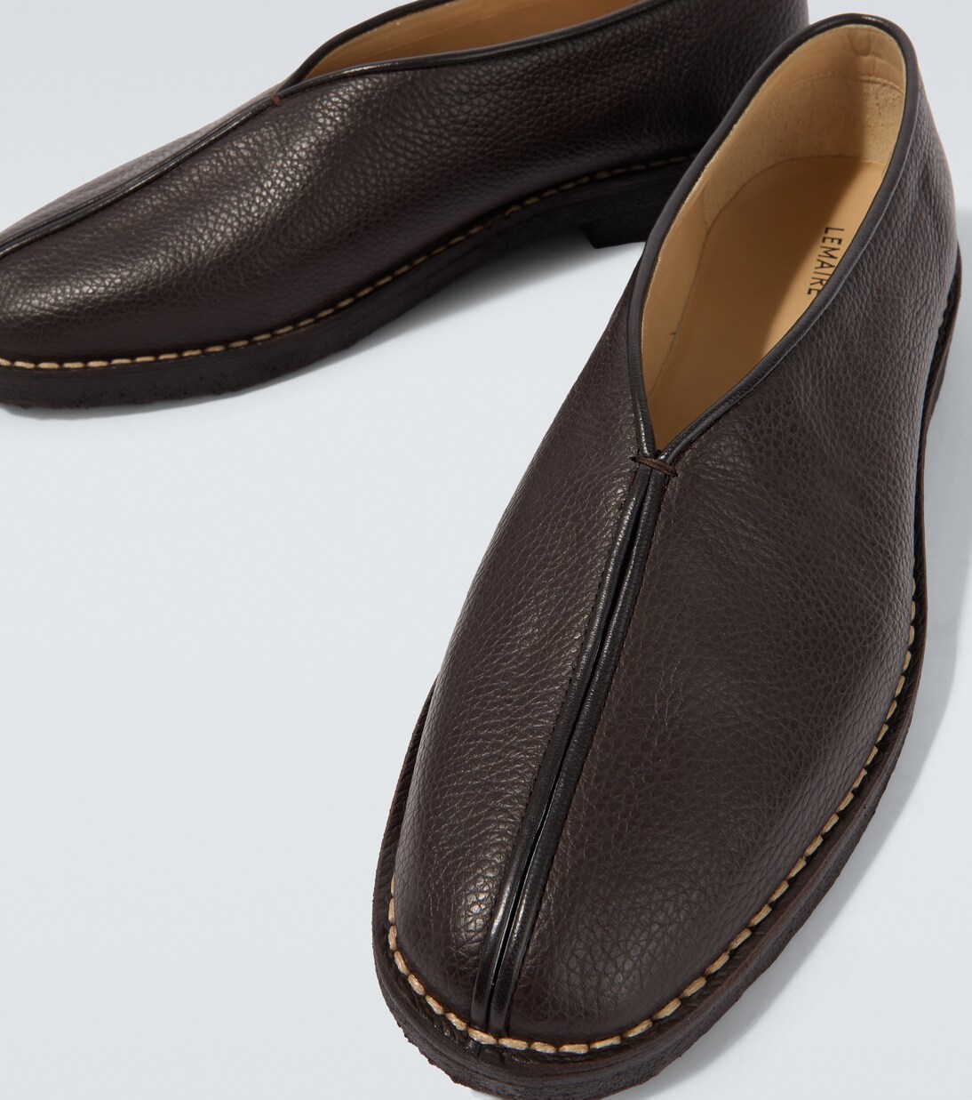 Piped leather slip-on shoes | Lemaire