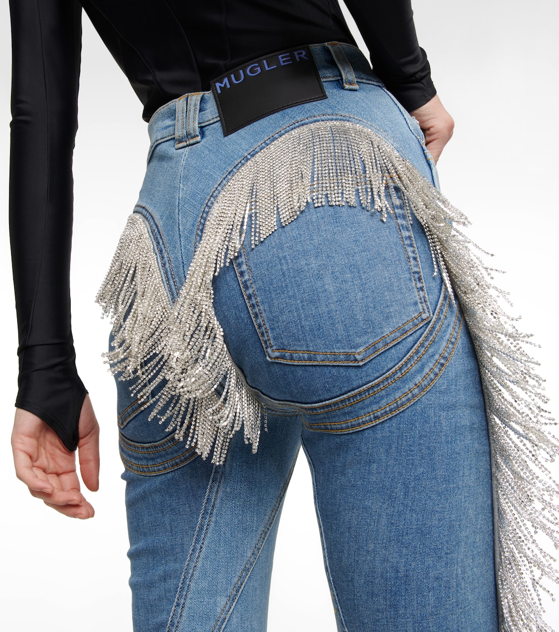 Spiral tassel-trimmed skinny jeans | Mugler