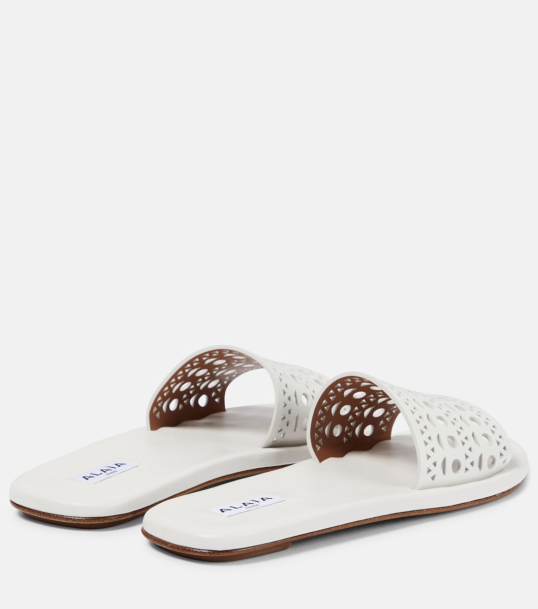 Laser-cut leather mules | Alaïa
