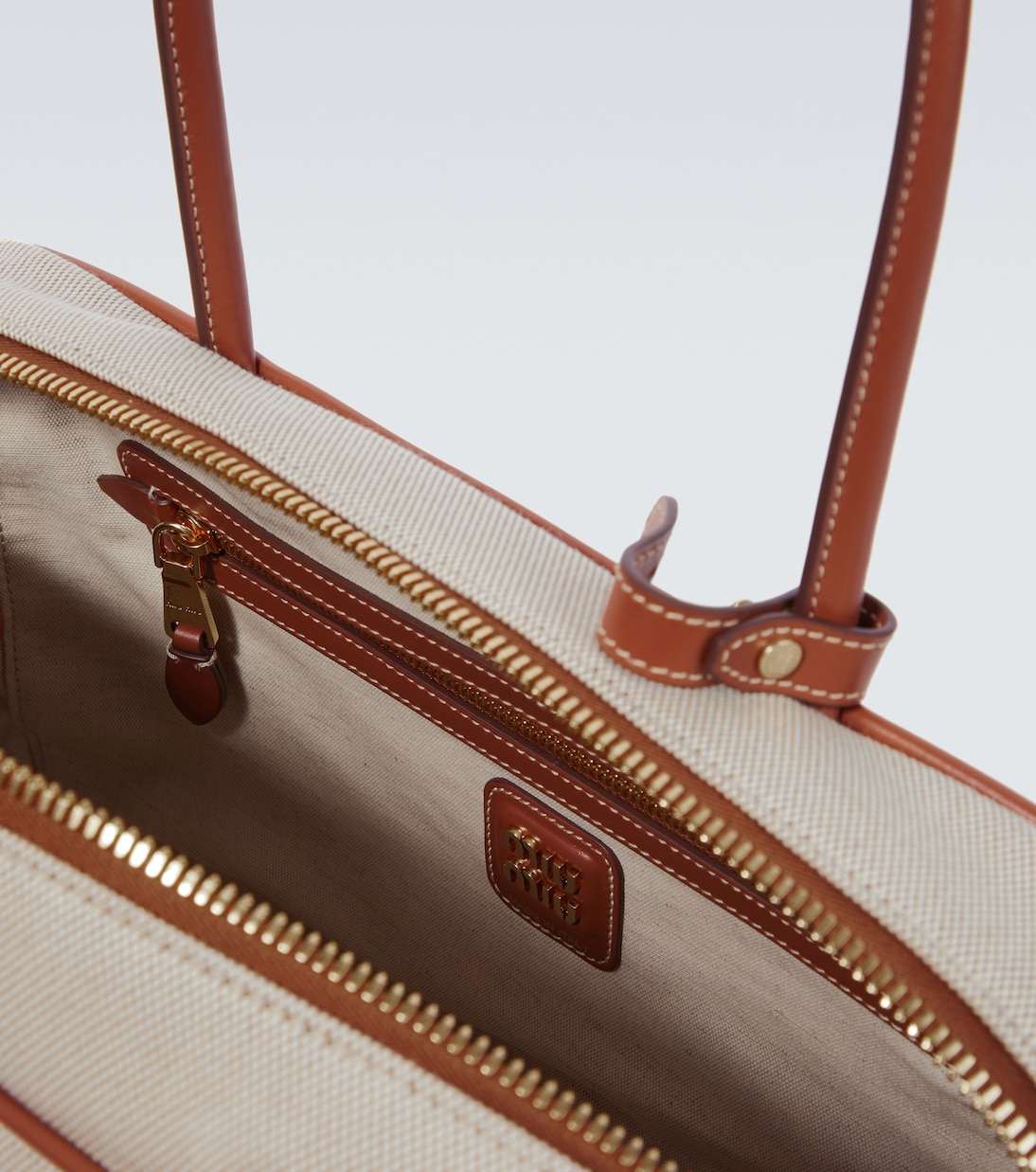 Logo leather-trimmed canvas tote bag | Miu Miu