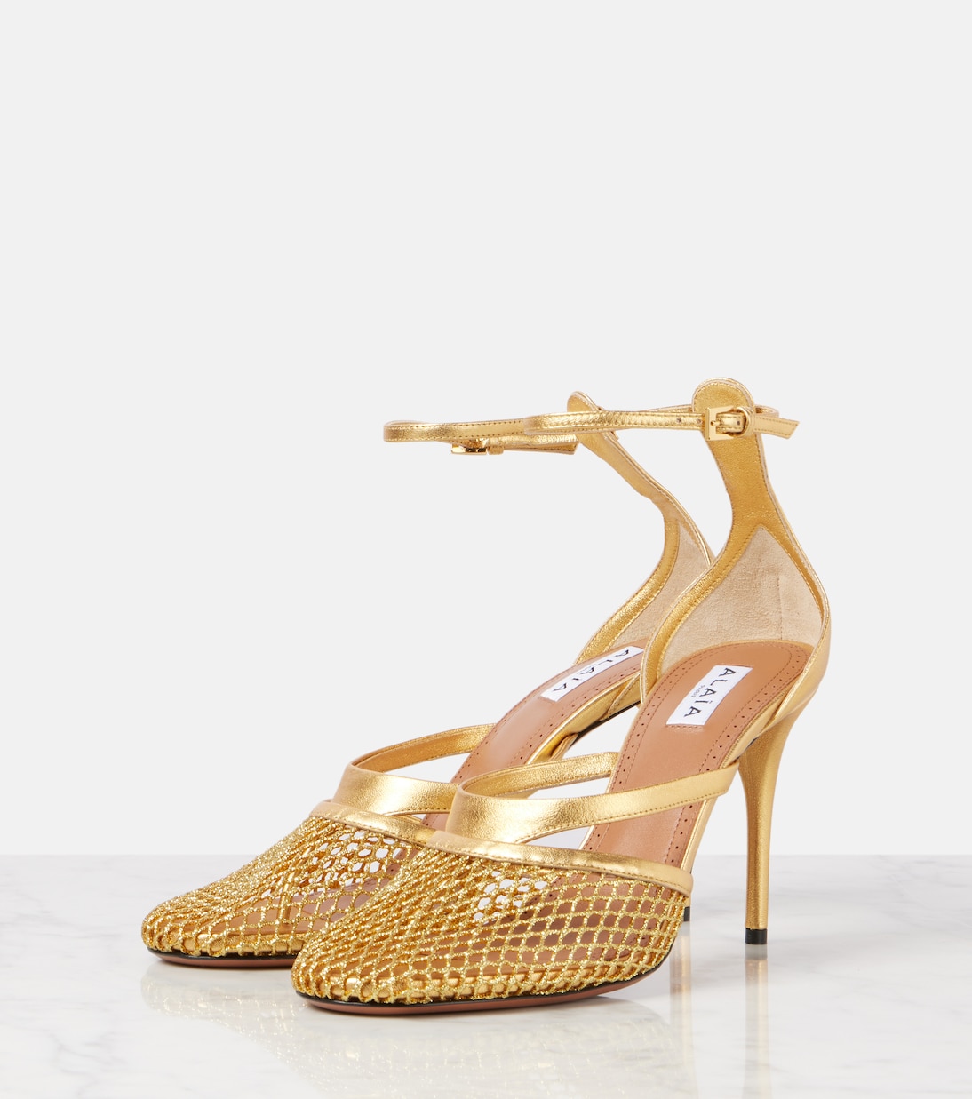 Scarpe con tacco ALAÏA in pelle e rete, perfette per un look giovane e audace