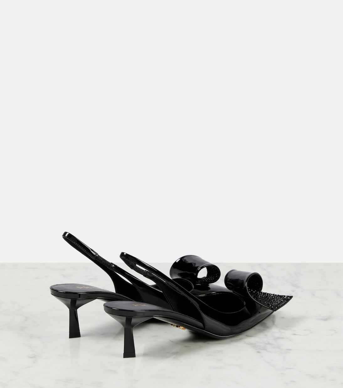 Escarpins en cuir verni à ornements | Prada