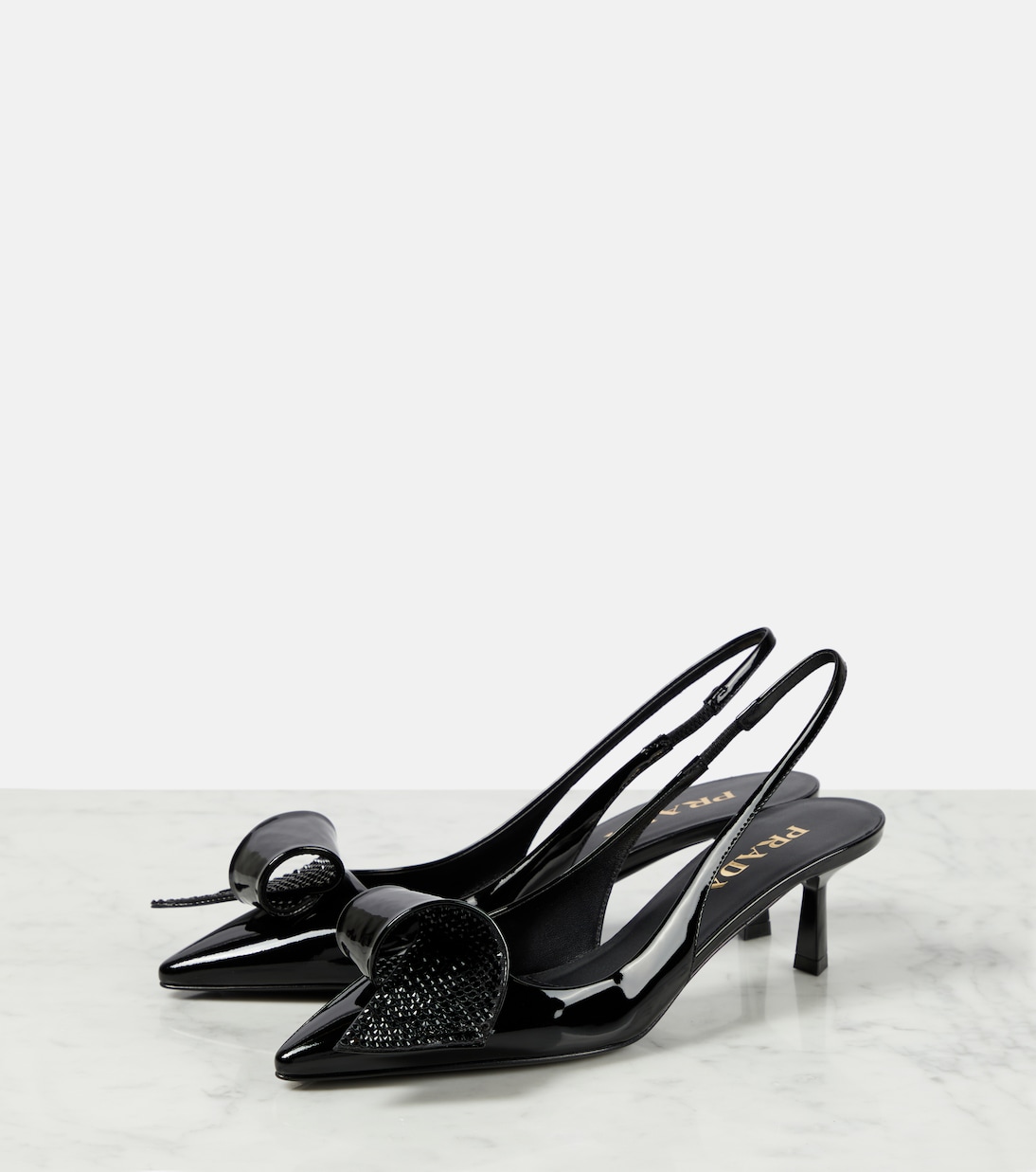 Escarpins en cuir verni à ornements | Prada