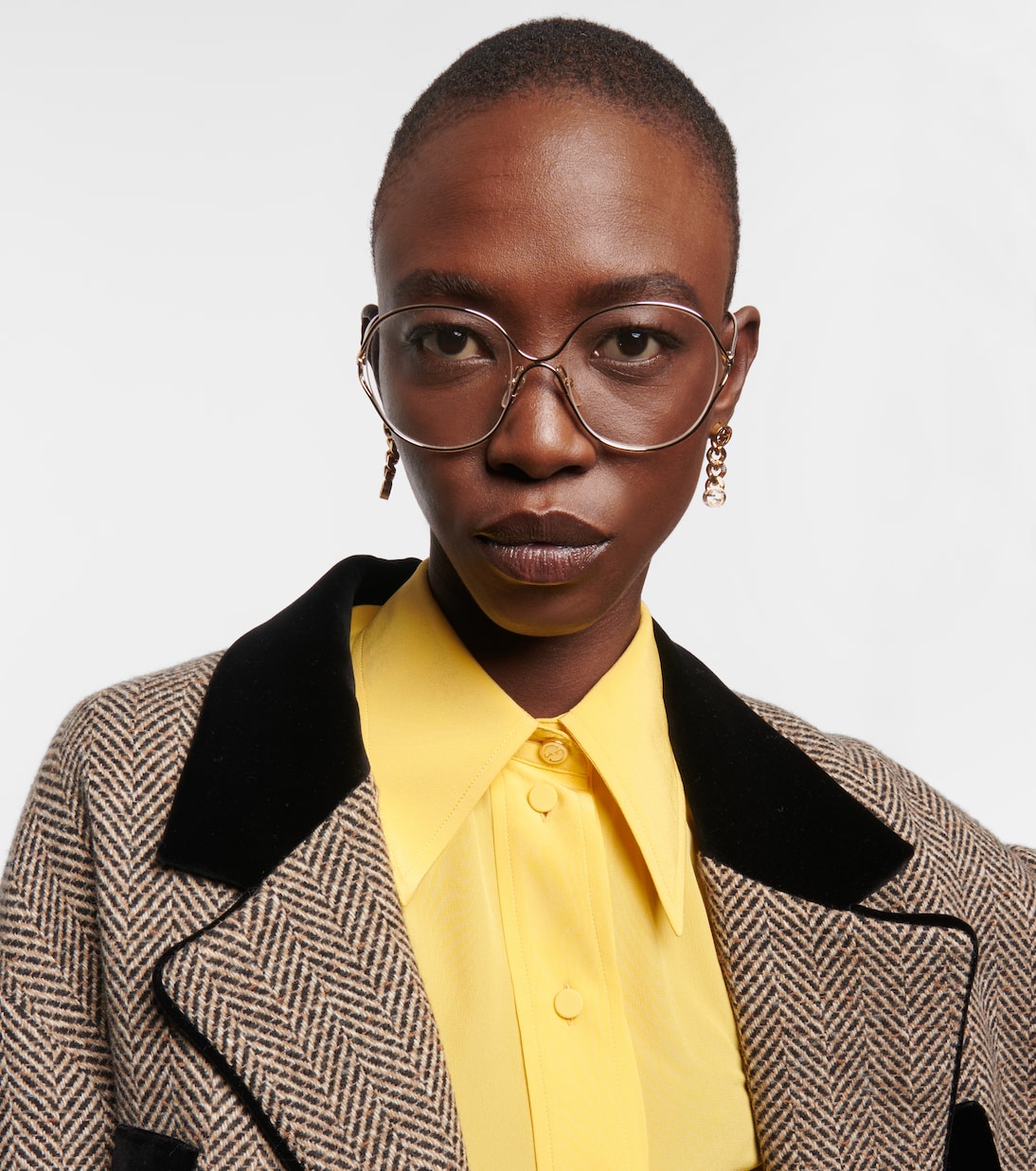 Round glasses in gold Gucci Mytheresa