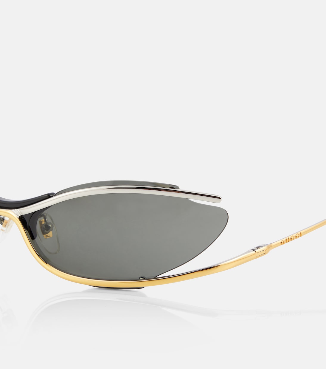 Oval sunglasses in gold Gucci Mytheresa