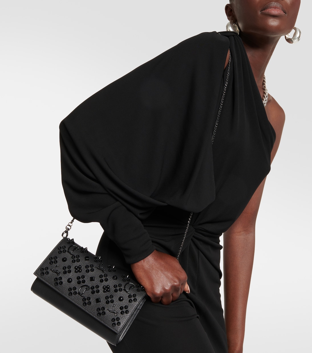 CLUTCH PALOMA IN PELLE CON DECORI DI CHRISTIAN LOUBOUTIN PER GIOVANI STILOSI