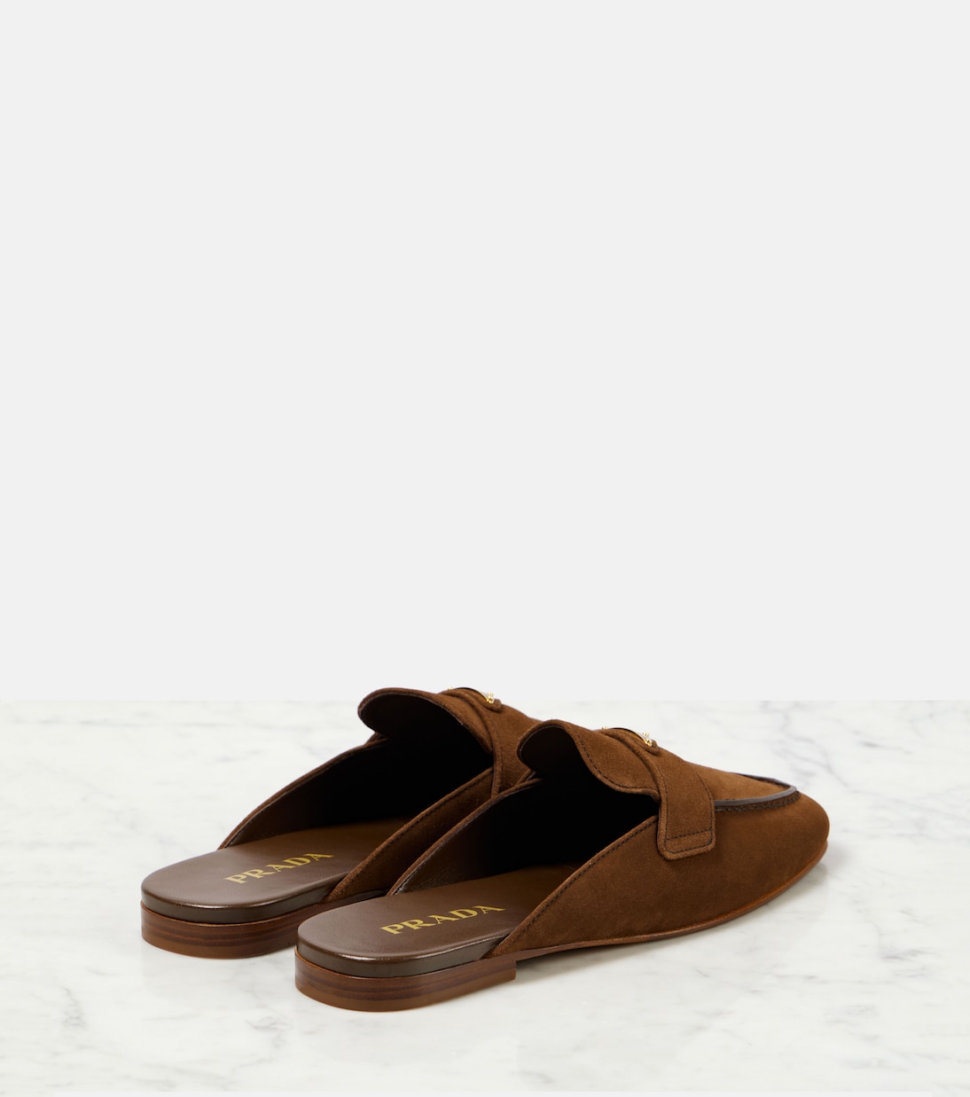 Mules in suede con logo | Prada