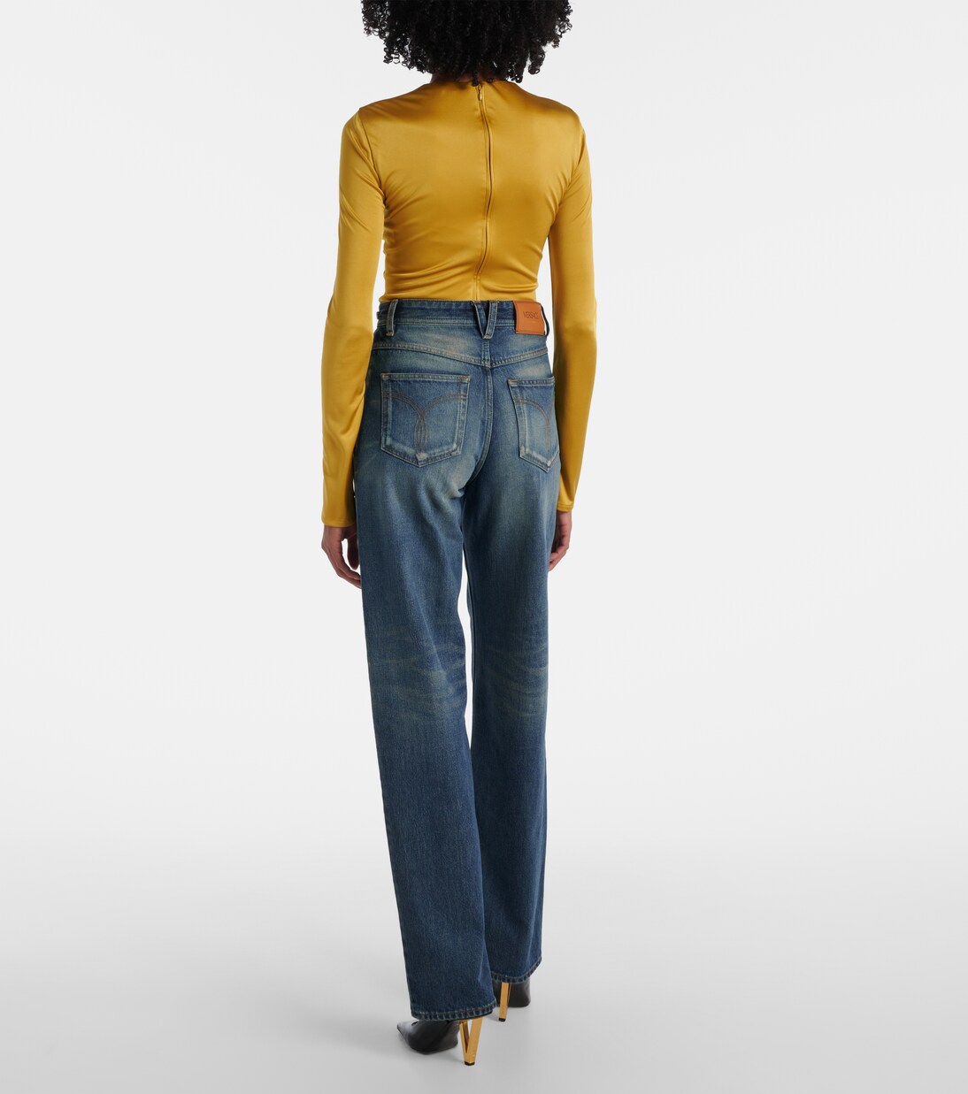 Jeans anchos de tiro alto con efecto desgastado | Versace