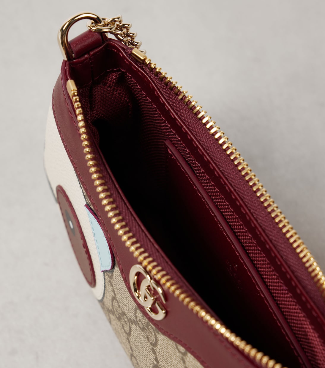 GG Mini panda-appliqué shoulder bag | Gucci