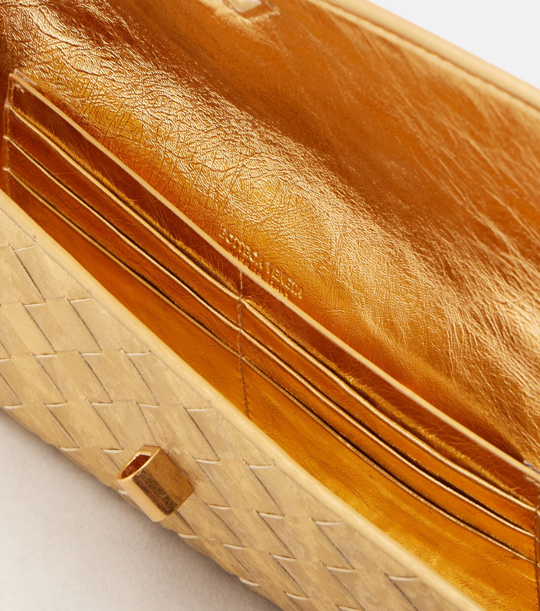 Andiamo Intrecciato metallic leather clutch | Bottega Veneta